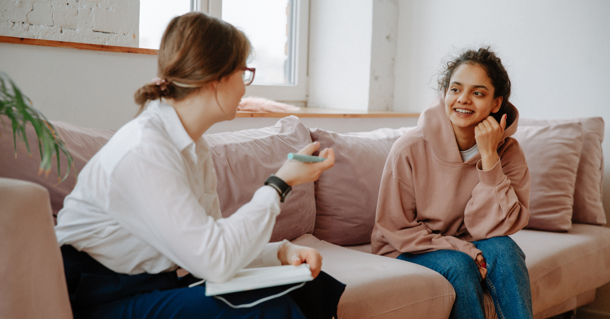 Woman speaks to a female counselor 