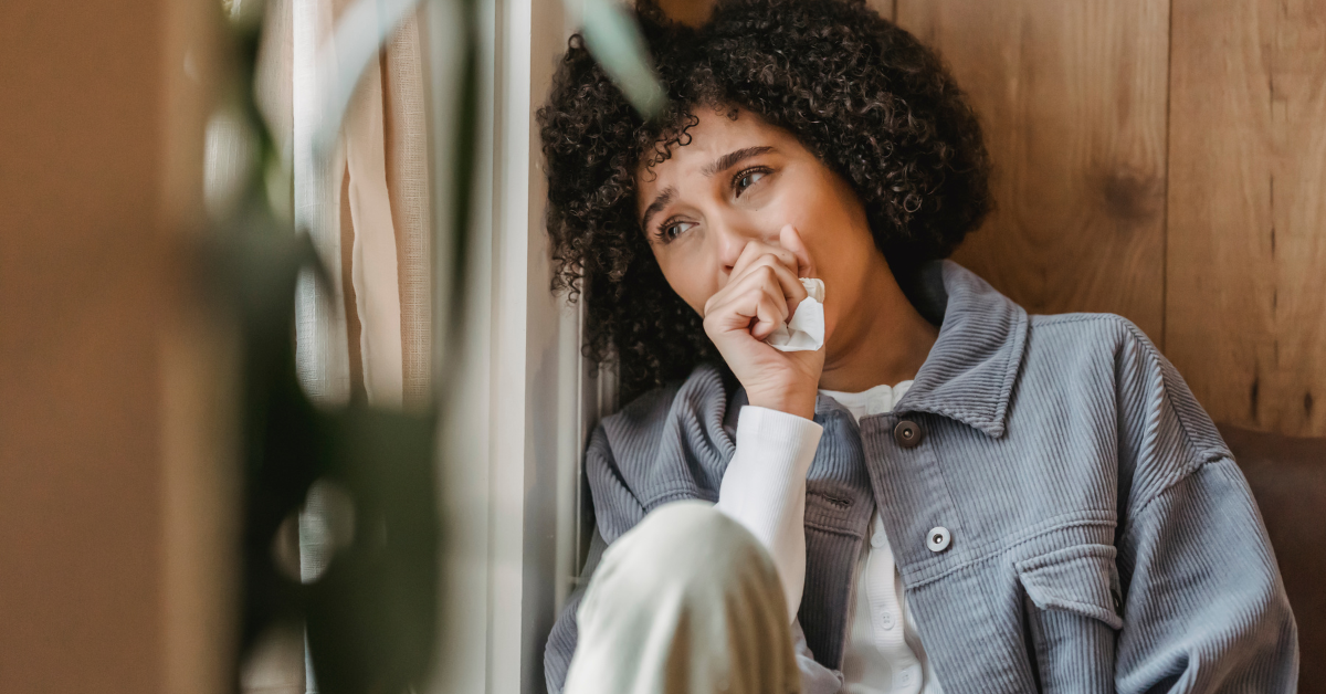 girl sitting on the floor crying